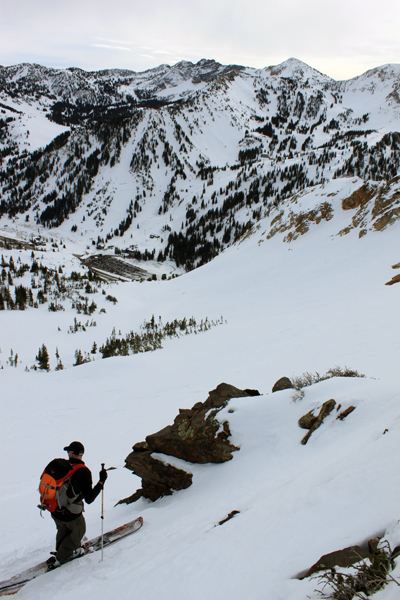 Mason Diedrich skins up to Cardiff Pass as he looks down on Alta below.
