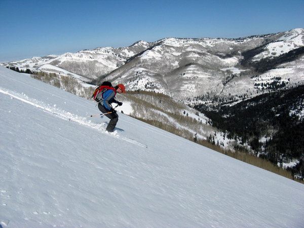 Skiing variable spring corn conditions in Silver Fork Canyon. Skier: Mason Diedrich