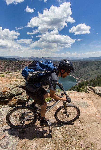The author rides a short bit of slickrock on the edge of Flaming Gorge. (Photo: Mike DeBernardo)