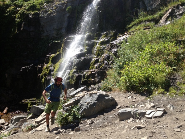 Adam passes a waterfall in the lower mountain. (Photo: Dave Zook)