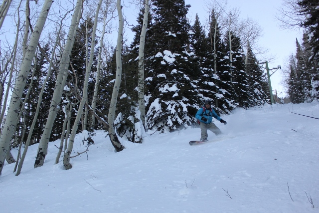 Adam Symonds snowboards down the lift line at the Old Blue Mountain ski resort. (Photo: Jared Hargrave - UtahOutside.com)