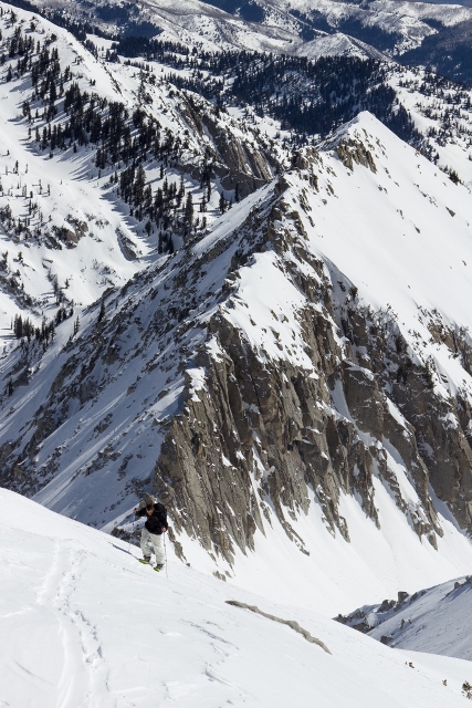 John Monstrola near the summit with a final boot pack above lesser mountains. (Photo: Mike DeBernardo.)
