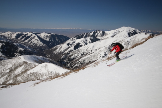 Sean Zimmerman-Wall skis down the southeast face of Rocky Peak on splendid, spring corn. (Photo: Jared Hargrave - UtahOutside.com)