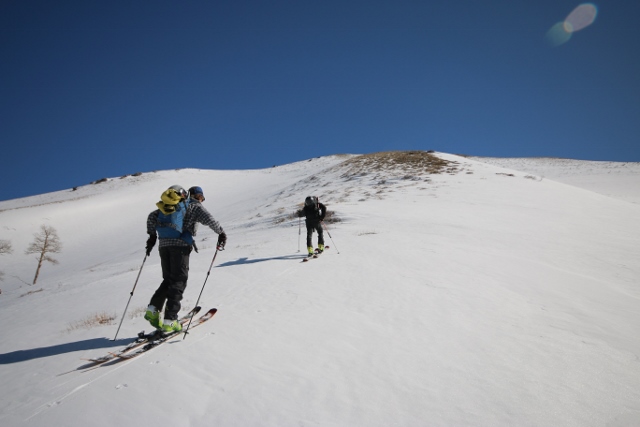 The crew ascends a sub ridge of Lowe Peak. (Skiers: Mike DeBernardo and Sean Zimmerman-Wall. Photo: Jared Hargrave - UtahOutside.com)