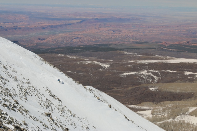 Adam skis down the north face of Haystack Mountain in the La Sal's with a red rock backdrop. (Photo: Jared Hargrave - UtahOutside.com)
