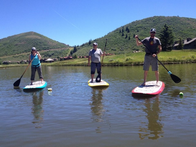 Standup Paddleboarding is a fun workout on the lake, plus it's easy to learn on the calm water at Deer Valley. (Photo: Callista Pearson - UtahOutside.com)
