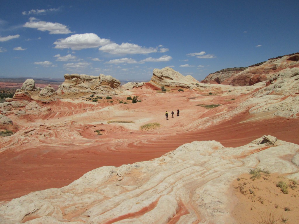 Hikers explore the White Pocket region near Kanab, UT. Some of the rock striations look very similar to The Wave area, which is just north of here. (Photo: Ryan Malavolta)