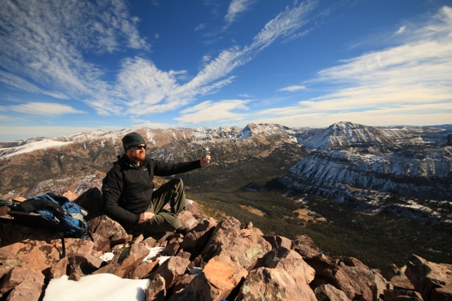 The author enjoys a summit brew atop A1 Peak in honor of Ullr. (Photo: Mason Diedrich)