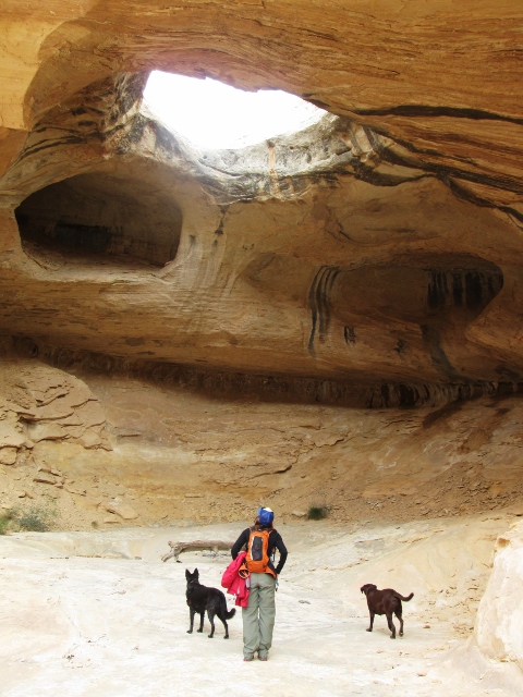 Hiker Jess Holzbauer checks out the Wild Horse Window, which is a natural bridge in the San Rafael Reef. (photo: Ryan Malavolta/Utahoutside.com)