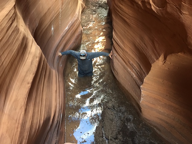 Hiker Skip Whitman wades through one of the deep pools found in Little Death Hollow after heavy spring rains in 2015. (photo: Ryan Malavolta/Utahoutside.com)