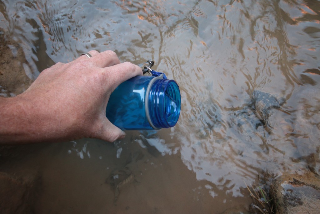 Filling the LifeStraw Go bottle with water to filter as as easy as... well, filling the bottle. Dip it in a river or lake, screw on the straw-attached lid, and drink up. (Photo: Jared Hargrave - UtahOutside.com)