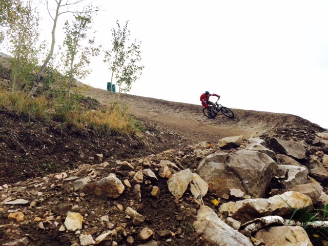 Huge berms on the corners are a hallmark of the new mountain bike trail at Deer Valley called "Tidal Wave." (Rider: Sean Zimmerman-Wall.  Photo: Jared Hargrave - UtahOutside.com)