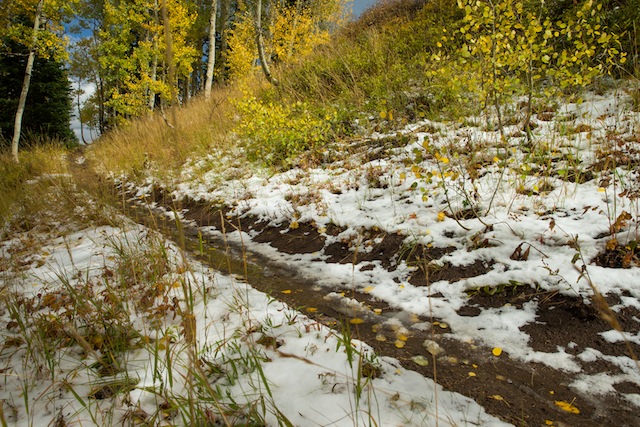 Autumn snowfall on Park City's trails signal the end of summer, but provides tacky dirt once it melts out. (Photo: Ross Downard Photography)