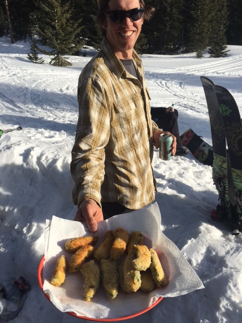 Mike DeBernardo offers up some jalepeno poppers on the first night at Puffer Lake Yurt. (Photo: Eric Ghanem)