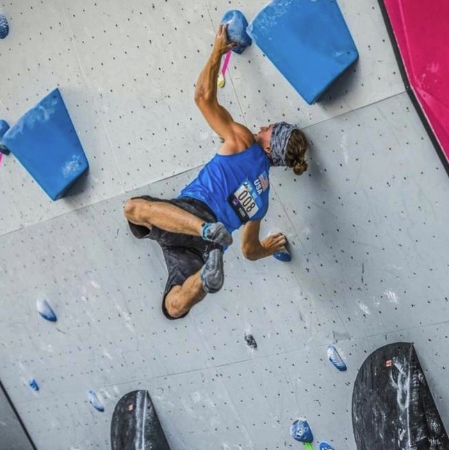 Nathanial Coleman at an indoor climbing competition.