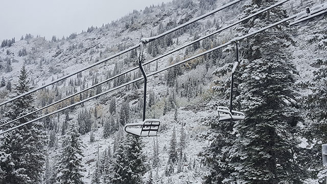 A chairlift is covered in powder in Little Cottonwood Canyon after a freak September storm (Photo: SkiUtah)