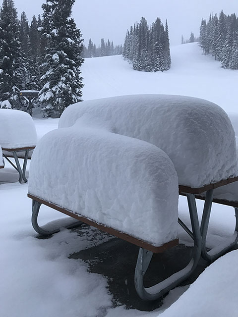 Tables at Solitude Mountain Resort show just how deep the snow was piling up during a big, 2016 early-season snow storm. (Photo: Solitude Mountain Resort)